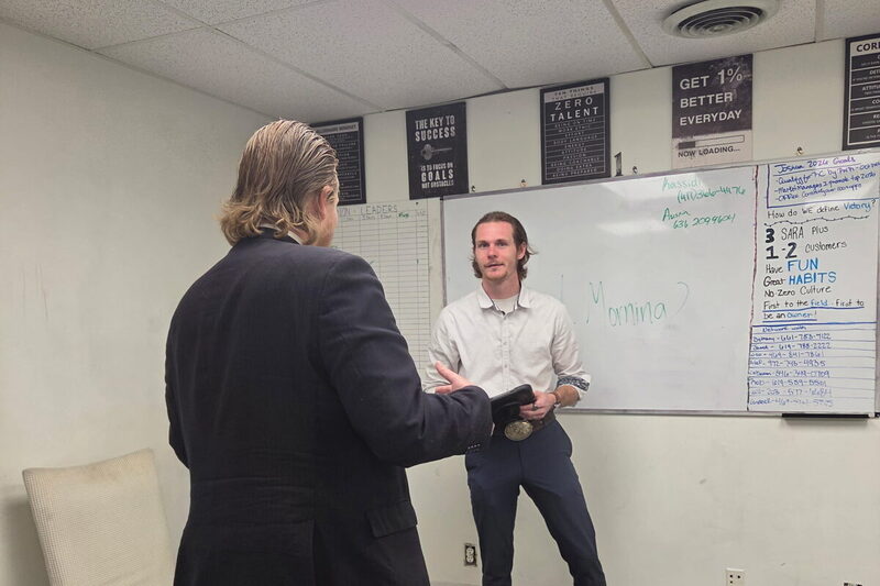 Morning sales training session at the office whiteboard
